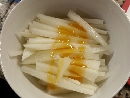 chop daikon into matchsticks and add honey and vinegar