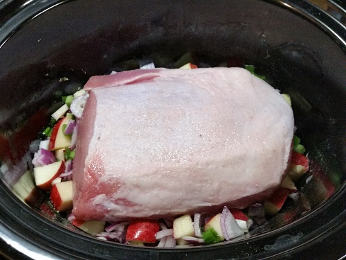 put pork roast fat side up in slow cooker