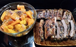 Family style AIP friendly BBQ pork ribs and warm sweet potato salad