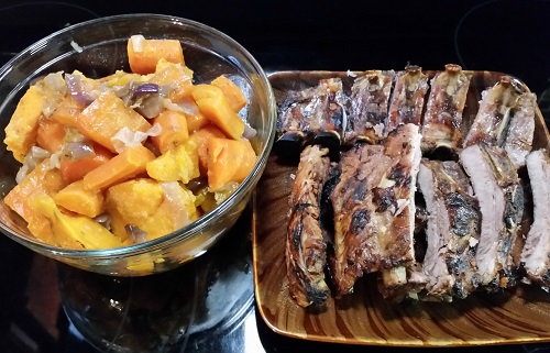 Family style BBQ ribs and warm sweet potato salad